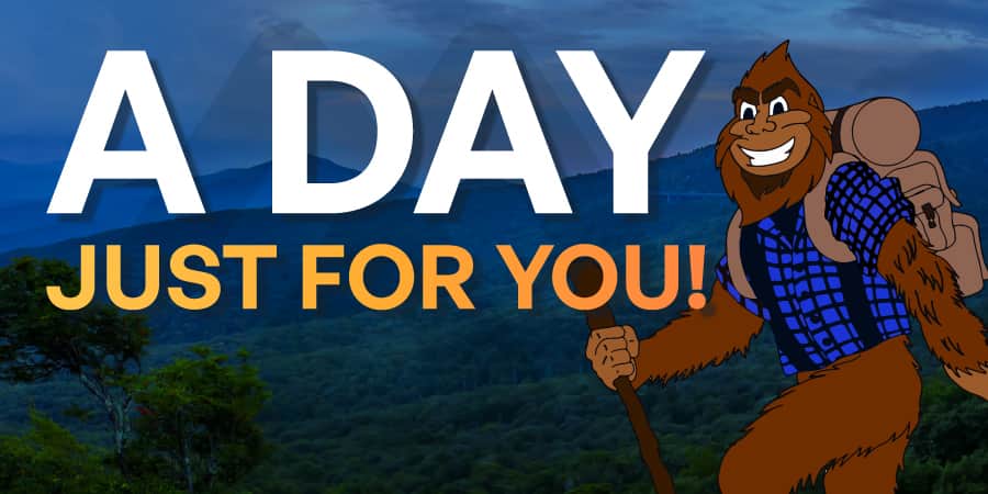 Marv hiking against a backdrop of the Blue Ridge Mountains. Across the center, the words: a day just for you!