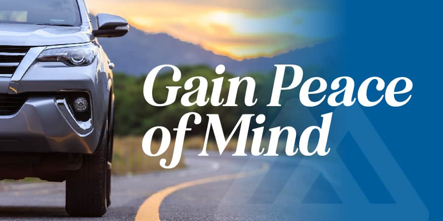 Front view of a silver SUV. To the right, the words: gain peace of mind.