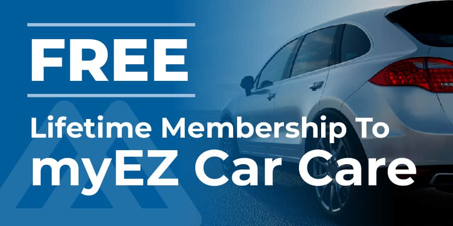 Side view of a silver SUV. Writen on the left, free lifetime membership to myez car care.